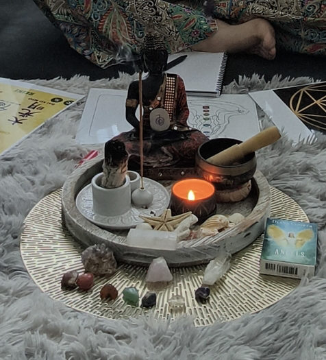 The crystals and candle of a Reiki session